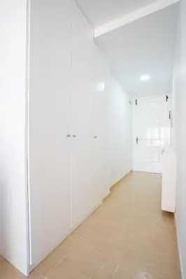 a room with white cabinets and a tile floor at Ideally Located Holiday Apartment in Moncófar