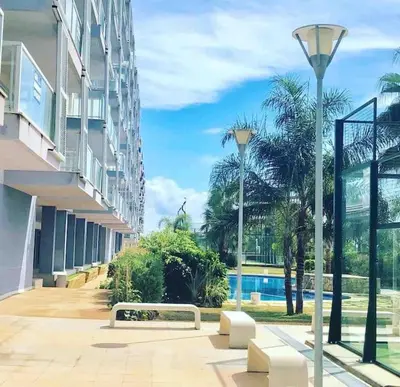a building with a bench and a street light at The Apartment Olivia in Moncófar