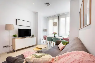 a living room with a couch and a table at G&V APARTMENTS CLOSE to CENTER in Valencia