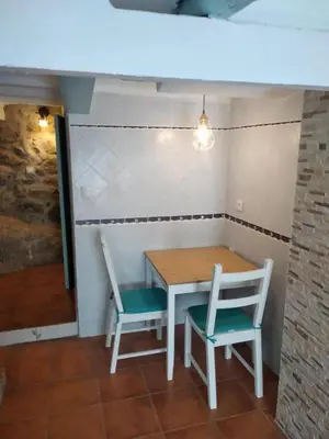 a table and two chairs sitting next to a table at La Vía Verde in Jérica