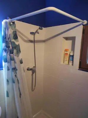 a shower with a shower curtain in a bathroom at La Vía Verde in Jérica