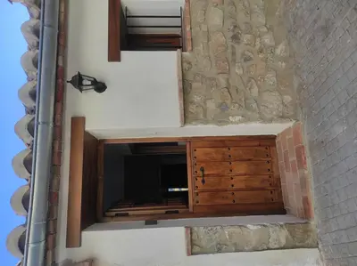 a room with a tv in a wall at La Vía Verde in Jérica