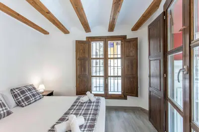 a bedroom with a bed and a window at ApartUP Central Market I in Valencia