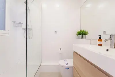 a bathroom with a shower and a toilet and a sink at R&C APARTMENTS CLOSE to CENTER in Valencia