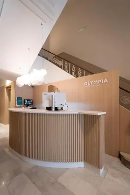 a lobby of an olympia office with a counter at Olympia Consul del Mar in Valencia