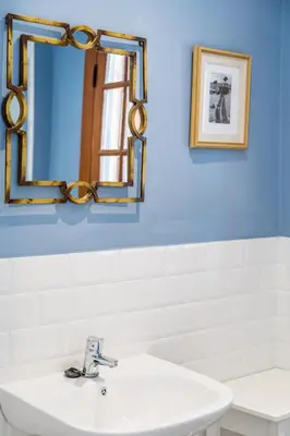 a bathroom with a sink and a mirror at La Colina in Puebla de Vallbona