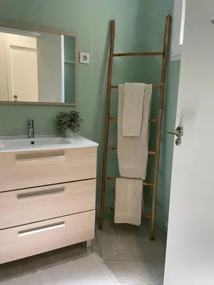 a bathroom with a sink and a mirror and a ladder at Slow Room Valencia in Valencia