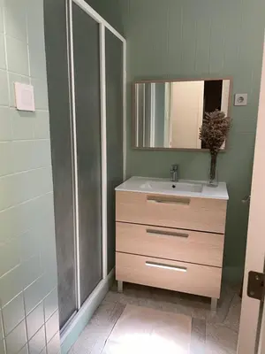 a bathroom with a sink and a mirror at Slow Room Valencia in Valencia
