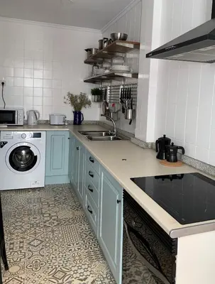 a kitchen with a sink and a washing machine at Slow Room Valencia in Valencia