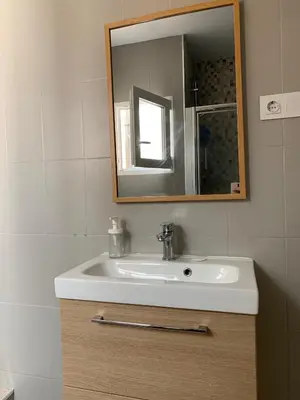 a bathroom with a sink and a mirror at Slow Room Valencia in Valencia