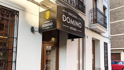 a bedroom with a bed and a painting on the wall at Hotel Original Domino House in Valencia