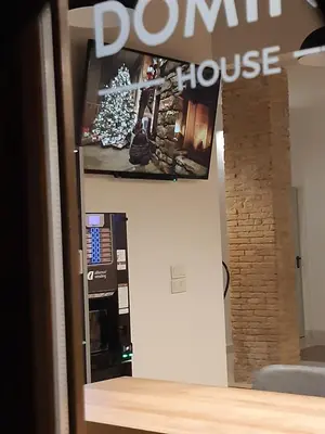 a domino house store with a sign on the wall at Hotel Original Domino House in Valencia