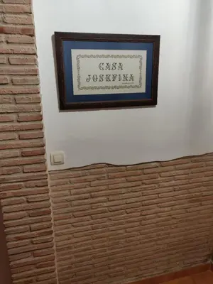 a picture on a wall with a brick wall at Casa Josefina in Yátova