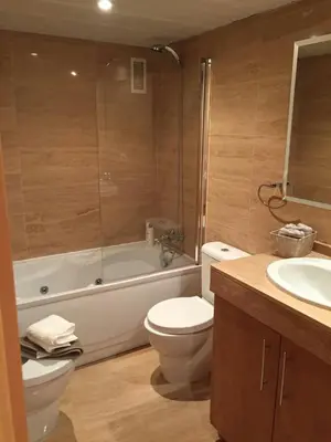 a bathroom with a toilet and a tub and a sink at Loft en la Ciudad de las Ciencias y cerca de la playa in Valencia