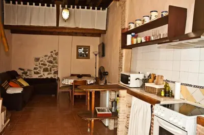 a bedroom with a bed with red pillows on it at La Casa Mora in Jérica