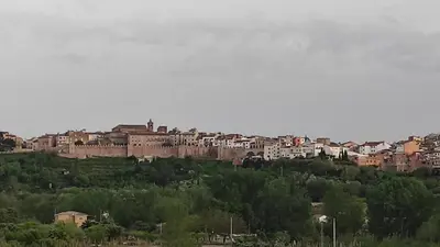 a group of buildings on top of a hill at La Media Luna in Segorbe
