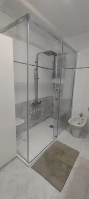 a glass shower in a bathroom with a sink at Calicanto House & Pool in Torrent