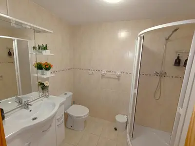a bathroom with a sink toilet and a shower at Seabreeze Lighthouse Apartment in Faro de Cullera