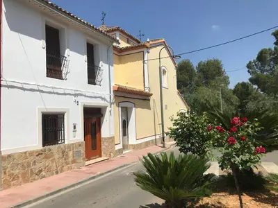 a street with two buildings on a street at Casa rural la ermita de Anna in Anna