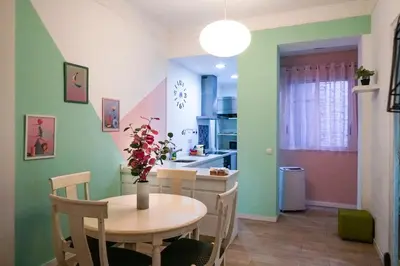 a kitchen and dining room with a table and chairs at Ruzafa Apartment in Valencia