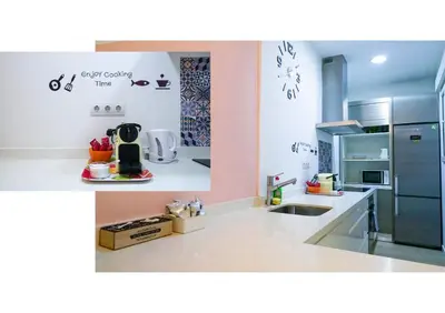 a kitchen with a sink and a refrigerator at Ruzafa Apartment in Valencia