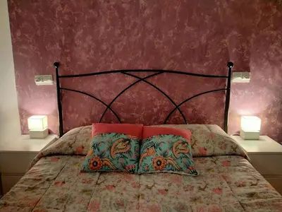 a bedroom with a bed with two pillows on it at Cabañal Port Marina in Valencia