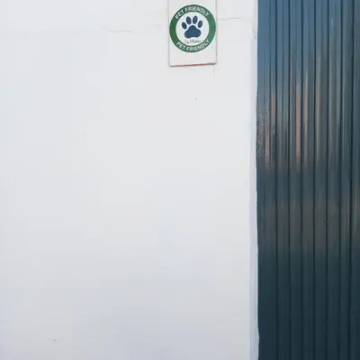 a clock on the side of a white wall at Ca Michico in Tous