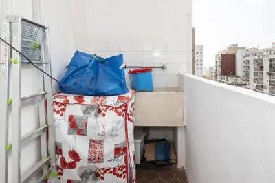 a room with a counter and a sink in a building at ROS MARY, 7º-14 in Cullera