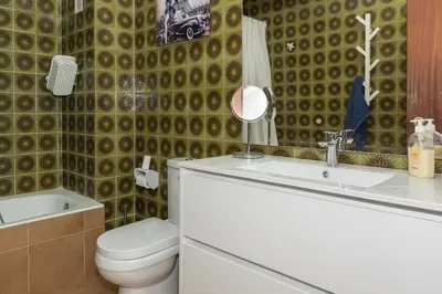 a bathroom with a toilet and a sink at ROS MARY, 7º-14 in Cullera