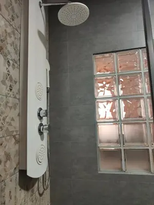 a shower door with a window in a bathroom at 150 Playa in Puerto de Sagunto