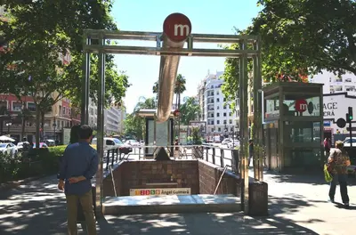 a man is standing in front of a structure on a street at COZY & MODERN Apartment junto a Metro A Guimerá in Valencia