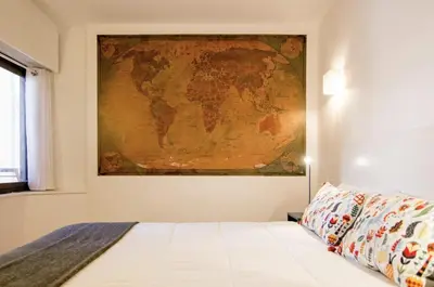a bedroom with a map of the world on the wall at Central Station. Free Wifi & Terrace in Valencia
