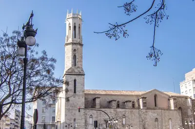 an old building with a clock tower on a street at Central Station. Free Wifi & Terrace in Valencia