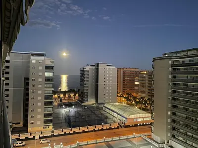 a view of a city with tall buildings at RELAX, MAR Y MONTAÑA in Tavernes de Valldigna
