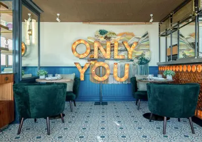 a dining room with a sign that reads only you at Only YOU Hotel Valencia in Valencia