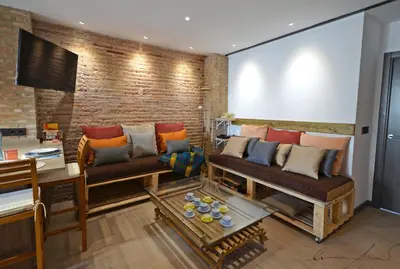 a kitchen with a sink and a stove at Casita en el Cabañal con Patio in Valencia