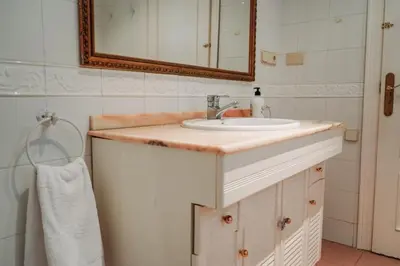 a bathroom with a sink and a mirror at Casa Modernista 