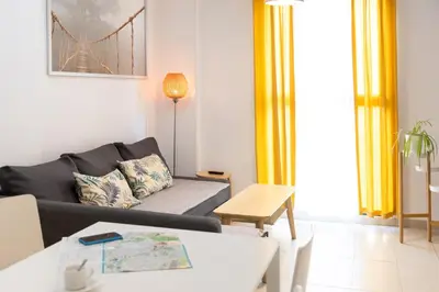 a living room with a couch and a table at Hideout 26 in Valencia