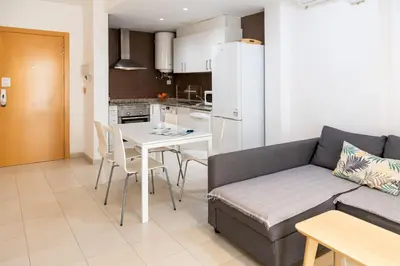 a living room with a couch and a table at Hideout 26 in Valencia