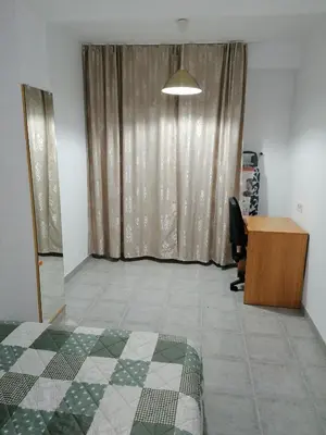 an office with a bed and a desk and a window at Fully Furnished Double Room in Valencia