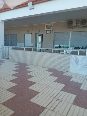 a building with a flag painted on the side of it at Broadway es Mar in El Perelló