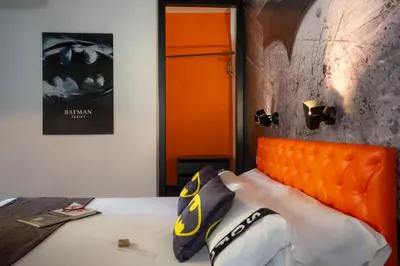 a bedroom with a bed with an orange headboard at Casual del Cine Valencia in Valencia