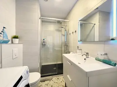 a bathroom with a shower and a sink and a toilet at Emma Apartment Central in Valencia