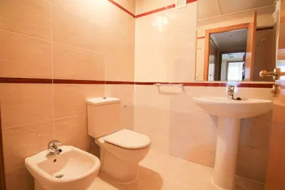 a bathroom with a toilet and a sink at NEW! Apartamento Ciudad de las Artes in Valencia