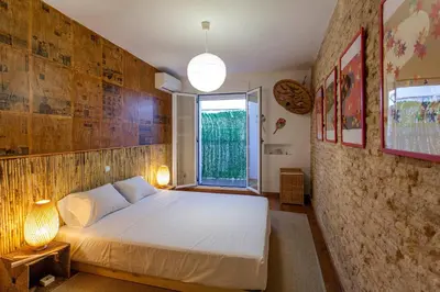 a bedroom with a white bed in a room with a window at LUXURIOUS & ALLURING HOME IN HISTORIC TOWN (VALENCIA) in Valencia