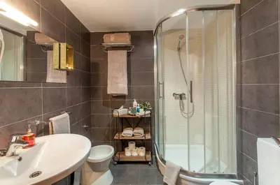 a bathroom with a shower and a sink and a toilet at LUXURIOUS & ALLURING HOME IN HISTORIC TOWN (VALENCIA) in Valencia