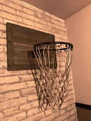 a basketball hoop hanging on a brick wall at Hografic Hotel in Valencia