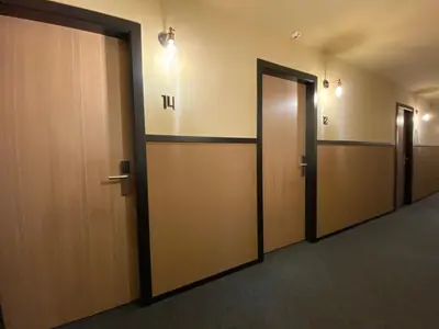 a row of elevators in a hallway with doors at Hografic Hotel in Valencia