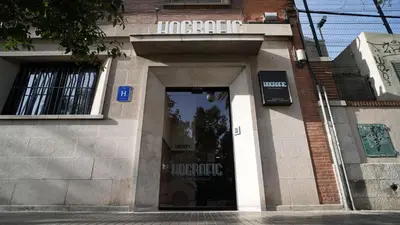 a store front with a door in a brick building at Hografic Hotel in Valencia
