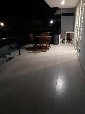 an empty room with chairs and a table in the dark at CANAL SALINAS Solo Familias Serviplaya in Casas Las Basas